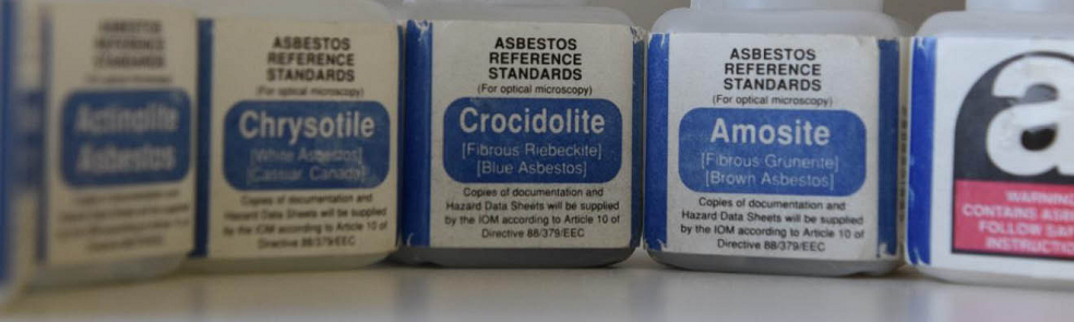 Asbestos Reference Standards banner image. Photo of asbestos reference standard samples in labeled bottles.